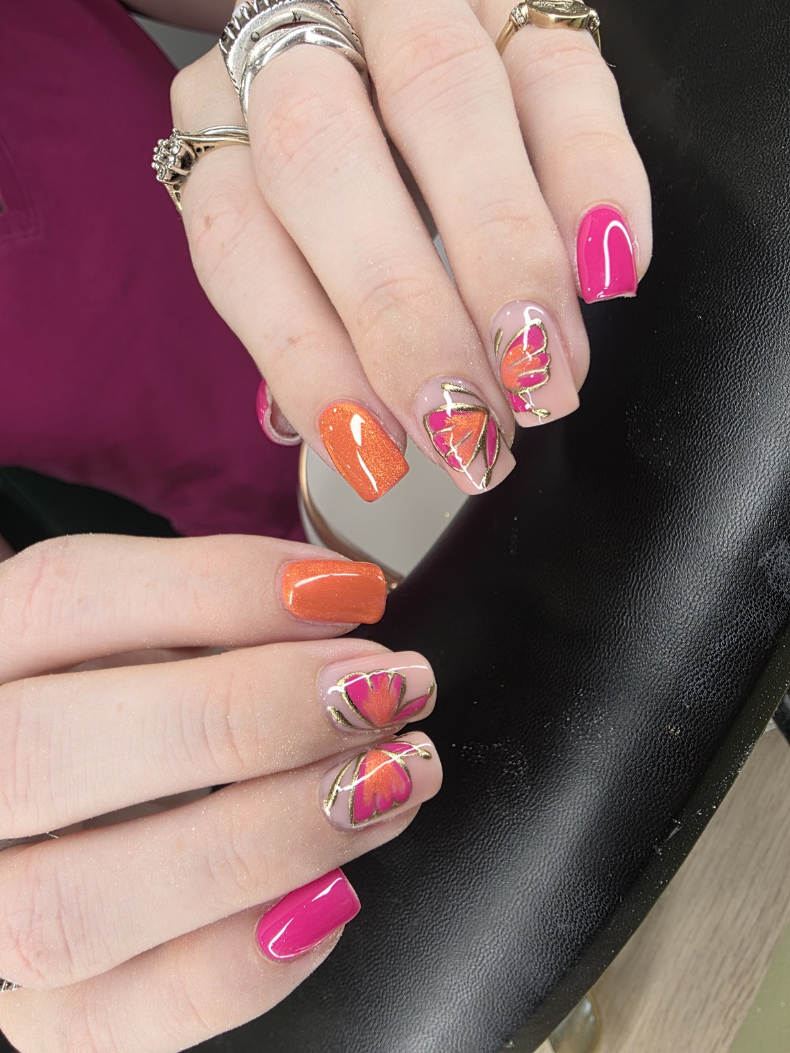 Bright pink and orange hand painted nail art